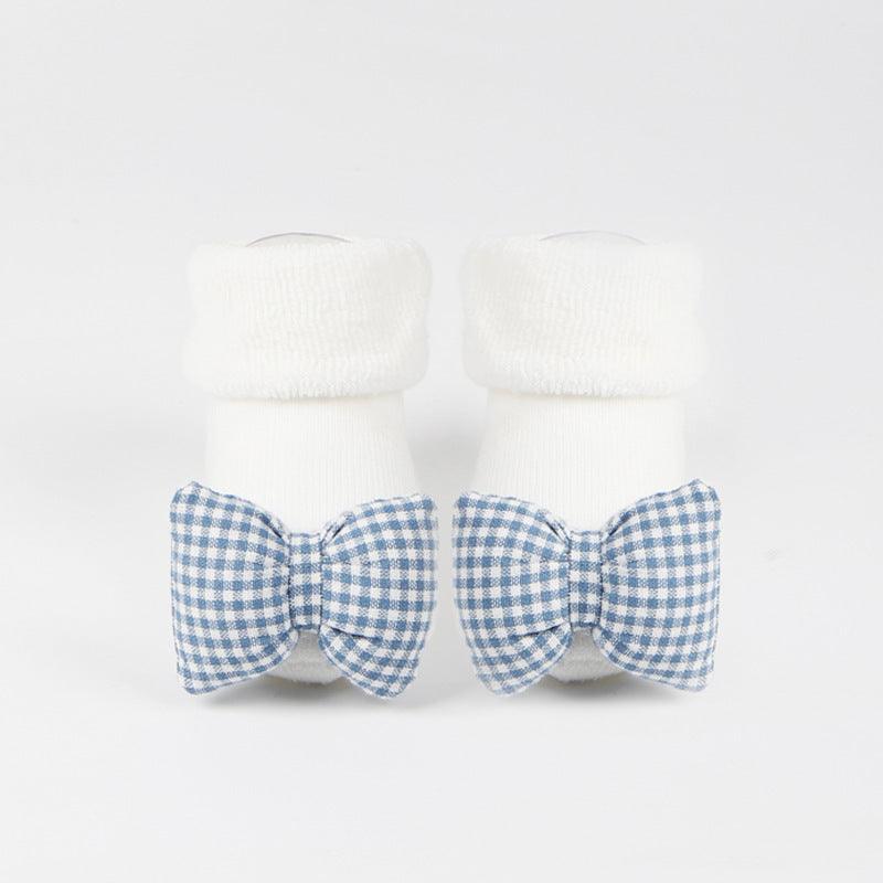 Cotton anti-slip baby socks for girls and boys with rubber soles and adorable design.