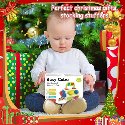 Baby playing with Montessori Busy Cube Sensory Toy, ideal toddler gift for Christmas.