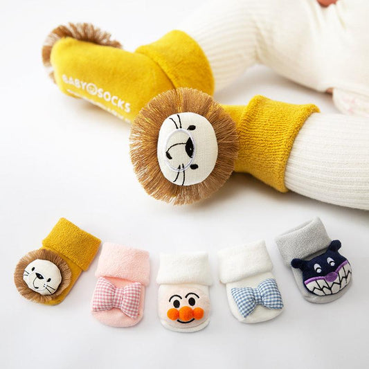 Adorable cotton baby socks with rubber anti-slip soles for girls and boys.