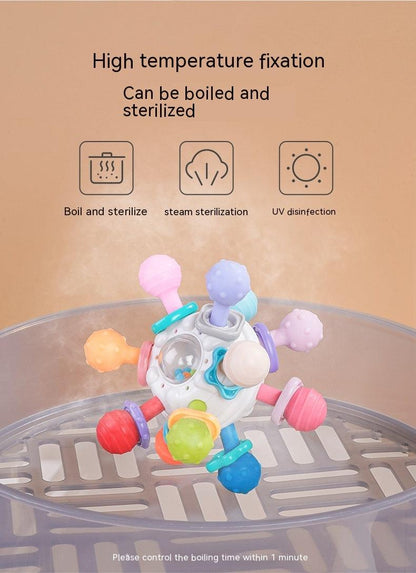 Colorful Baby Manhattan Finger Ball Rattle Toy on sterilizer tray, suitable for high-temperature disinfection.