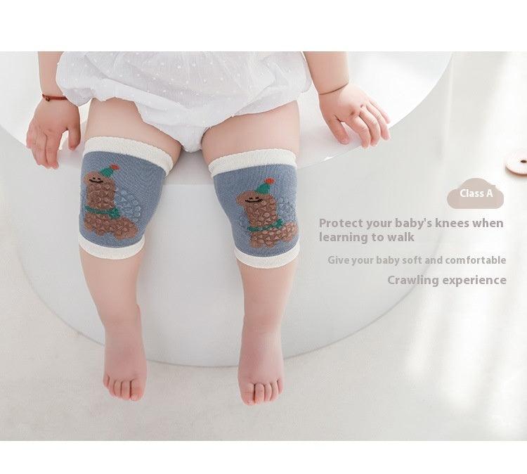 Baby wearing knee saver sleeves for protection while crawling.