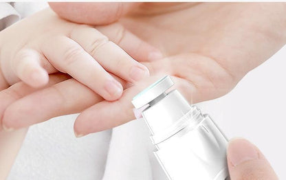 BabySafe Nail Care Kit with baby holding hand and electric nail trimmer.