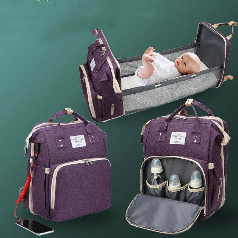 Portable double-shoulder large-capacity mommy bag with thermal insulation, featuring a diaper changing pocket and versatile compartments, shown in purple.