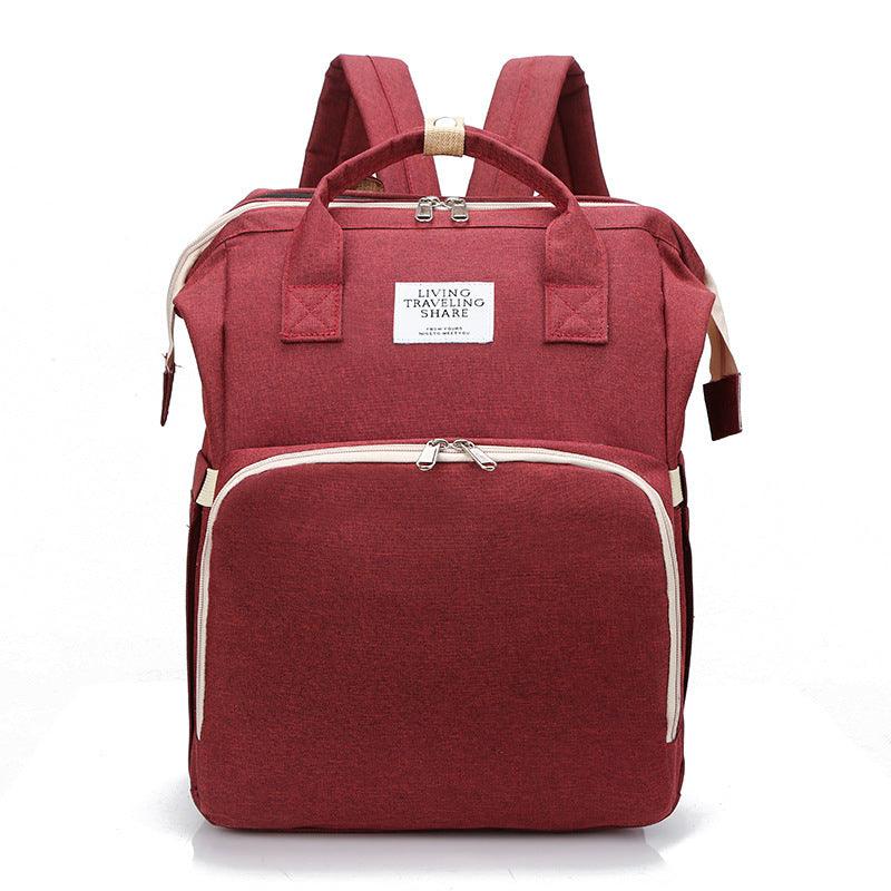 Portable Double-shoulder Large-capacity Mommy Bag in burgundy with thermal insulation, featuring multiple pockets and zipper closure.