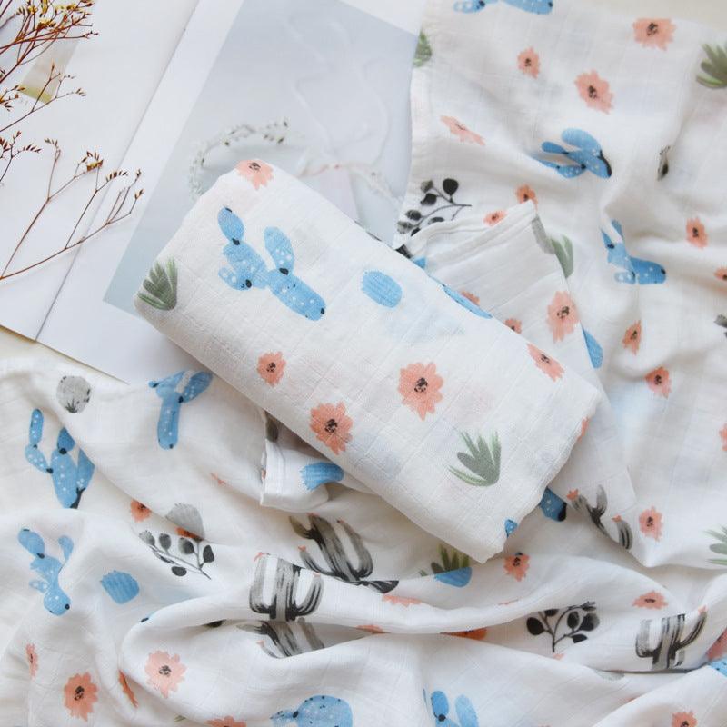 Cozy cartoon baby wraps with colorful floral and cactus print.