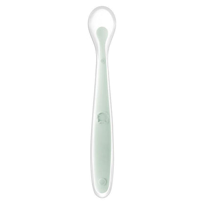 Silicone baby feeding spoon in fog green, practical and fresh design for infants over 3 months.