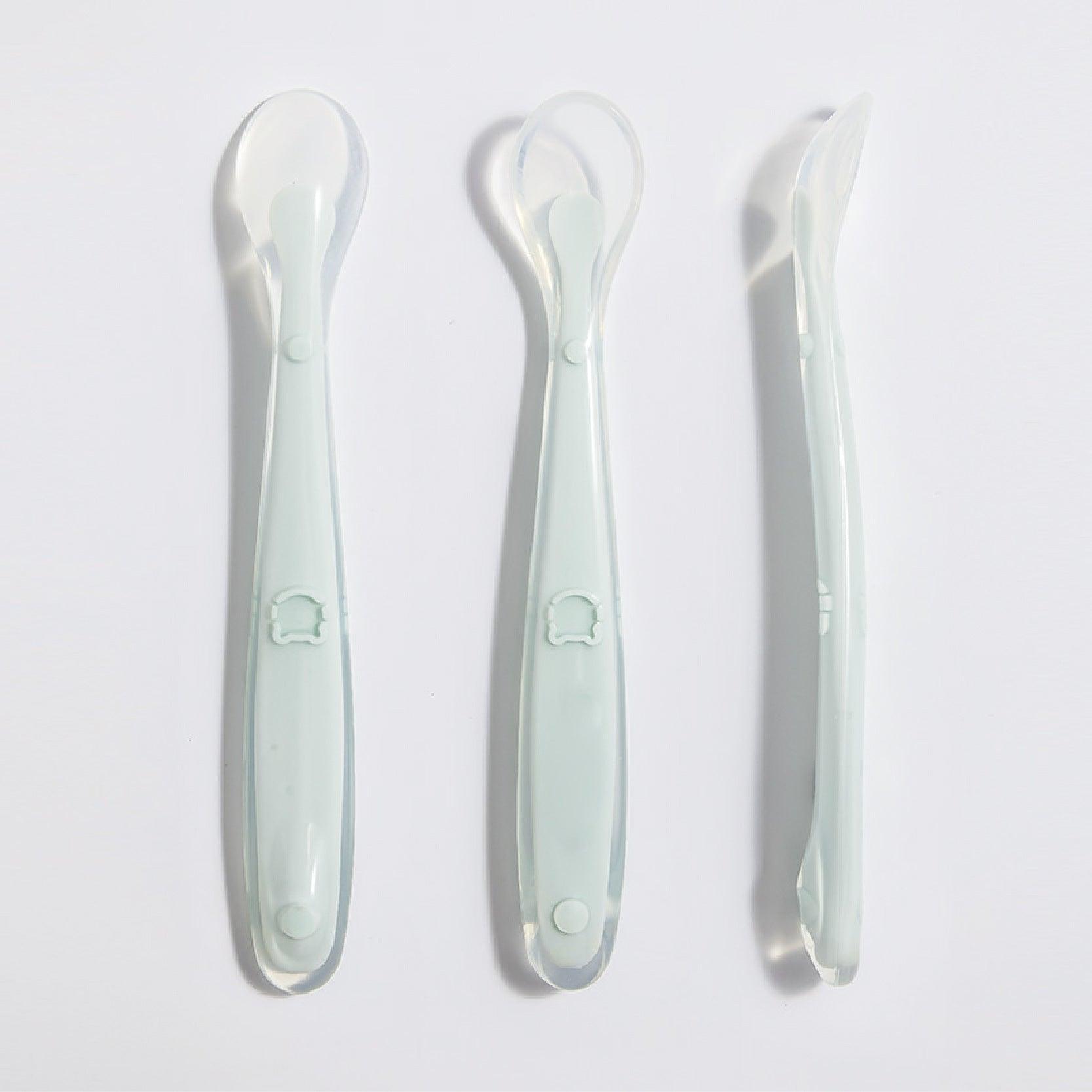 Silicone baby feeding spoon set for infants, fog green color, suitable for 3 months and older.