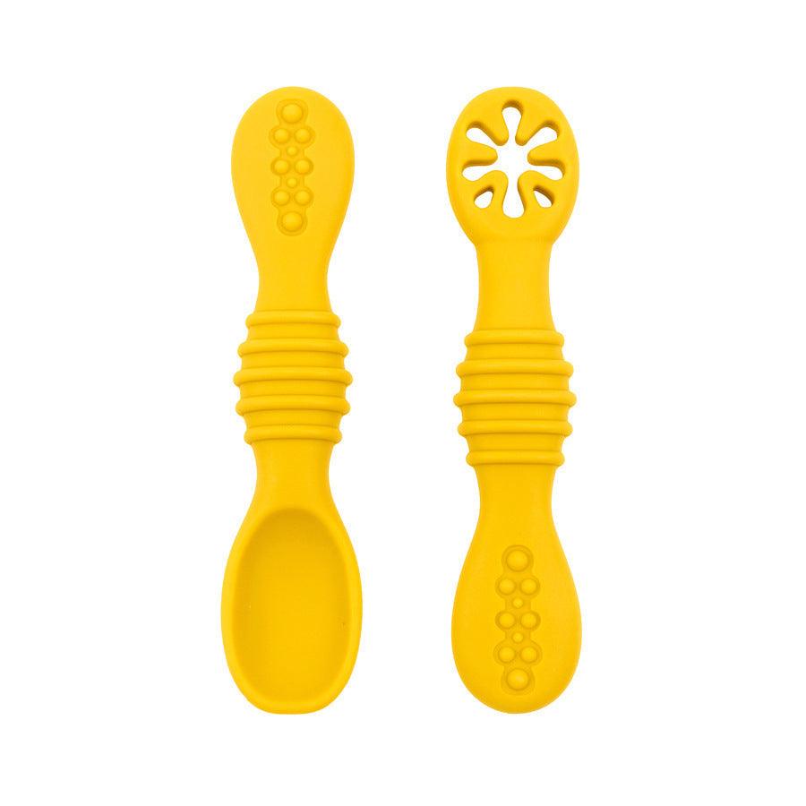 Silicone baby feeding spoon set in yellow color.