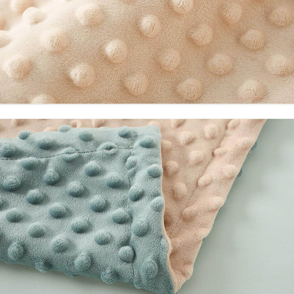 Ultra Soft Dotted Baby Blanket with plush fabric and dotted design in peach and blue.